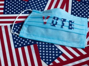 Die USA Wahl-Flagge mit Maske: Die Wahl rachte Erleichterung und steigende Kurse