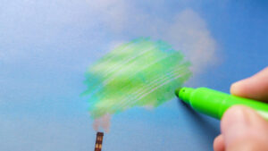Greenwashing dargestellt mit grünem Stift